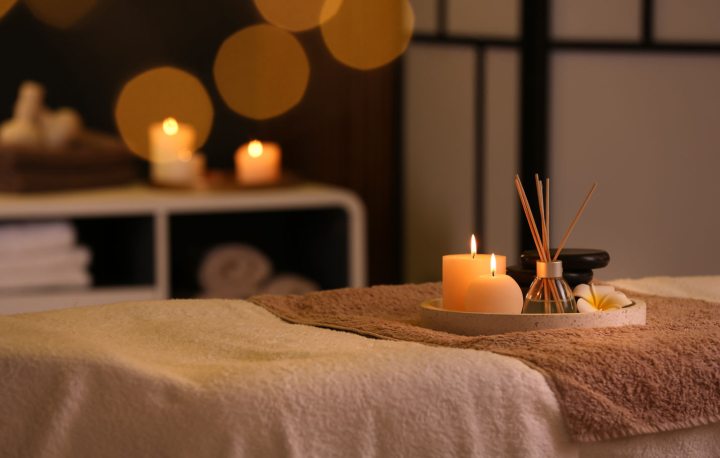 candle and incense in massage setting